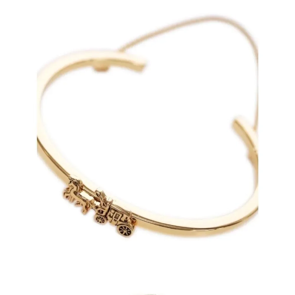 Coach gold tone